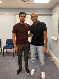 Placement awards - alumni Gaurav Prapanchakuta (left), wearing burgundy t-shirt and dark trousers, and Joseph Hanna (right), wearing light blue jeans and a black polo shirt