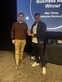 Prize winners Max Trorey, receiving his Outstanding Impact on Business Award