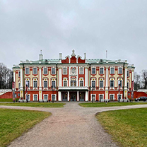 A typical Russian palace. It is beige and orange, angular and squat.