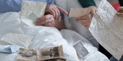 Two people looking at old photographs