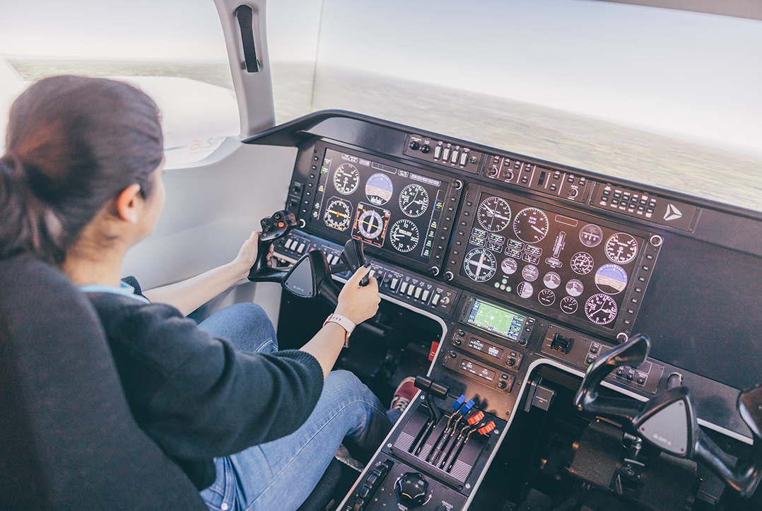 Undergraduate student piloting the flight simulator