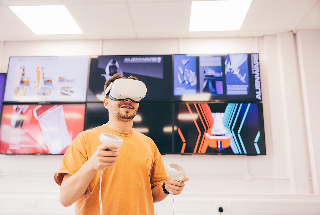 Undergradute student using a virtual reality headset in the Product Design Studio 1080px