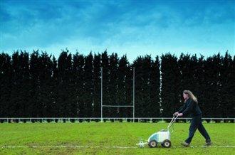 grounds person lining a rugby pitch with a fleet combi marking machine