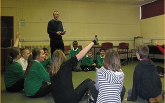 Andy Fisher with a group of pupils at a Philosophy in Schools session