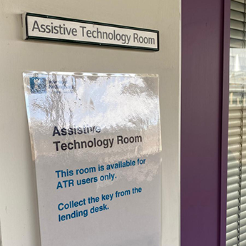 Close up of Assistive Technology Room sign