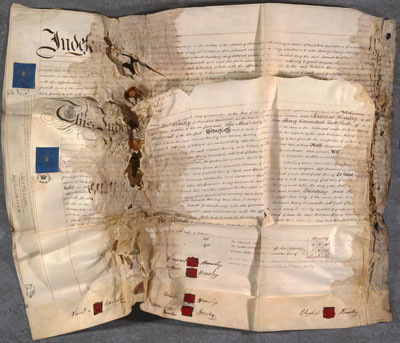 Damaged parchment deed, with parts of the membranes stuck together (Pl E12/6/20/21/7/1)