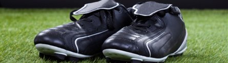 Football boots on a pitch