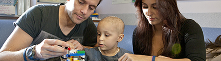 A young patient and parents at the Children's Brain Tumour Research Centre