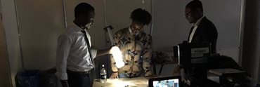 Members of Liter of Light Nigeria project team working on the solar lamp