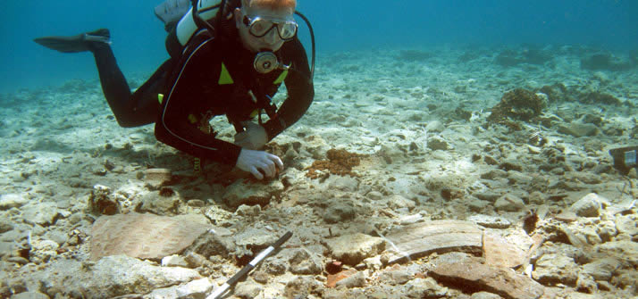 Diver over a spread of sherds from a Bronze Age storage jar