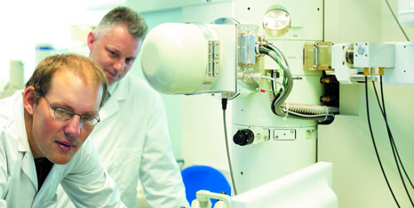 Two male members of staff using nanotechnology facilities
