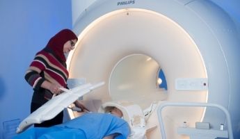 Dr Sally Eldeghaidy using an MRI scanner