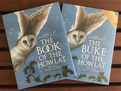 Photo of two copies of the book called 'The Book of the Howlat'. The cover is pale blue and features a large owl.