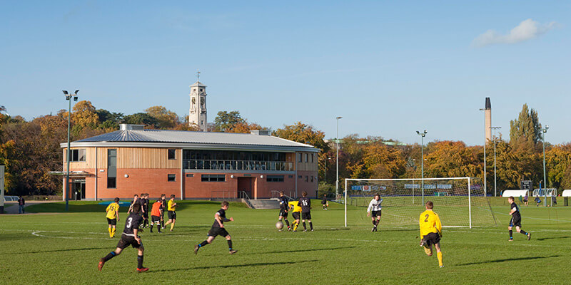 A football fixture taking place on one of the grass pitches at Highfields Sports Complex.