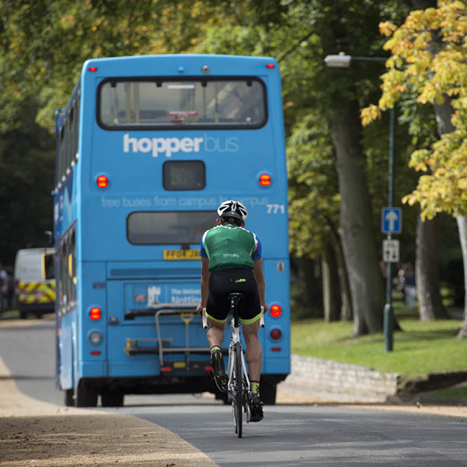 Hopper bus and cyclist on campus