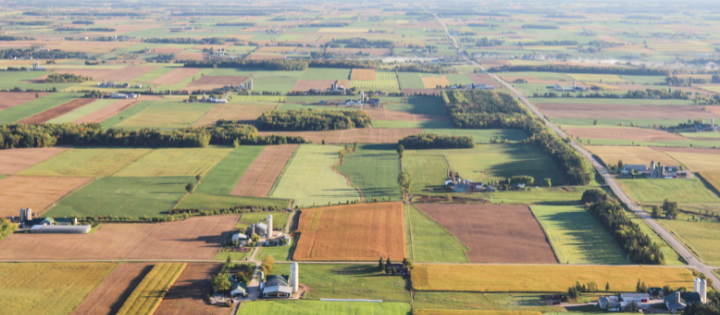 Aerial photography of brown and green fields