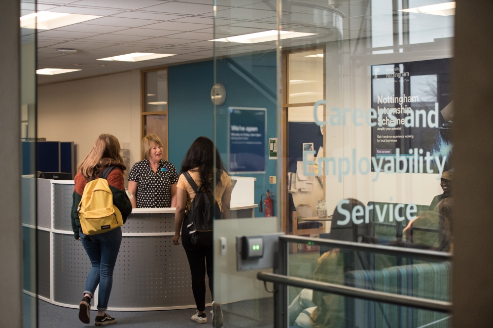 Students at the careers and employability service desk.