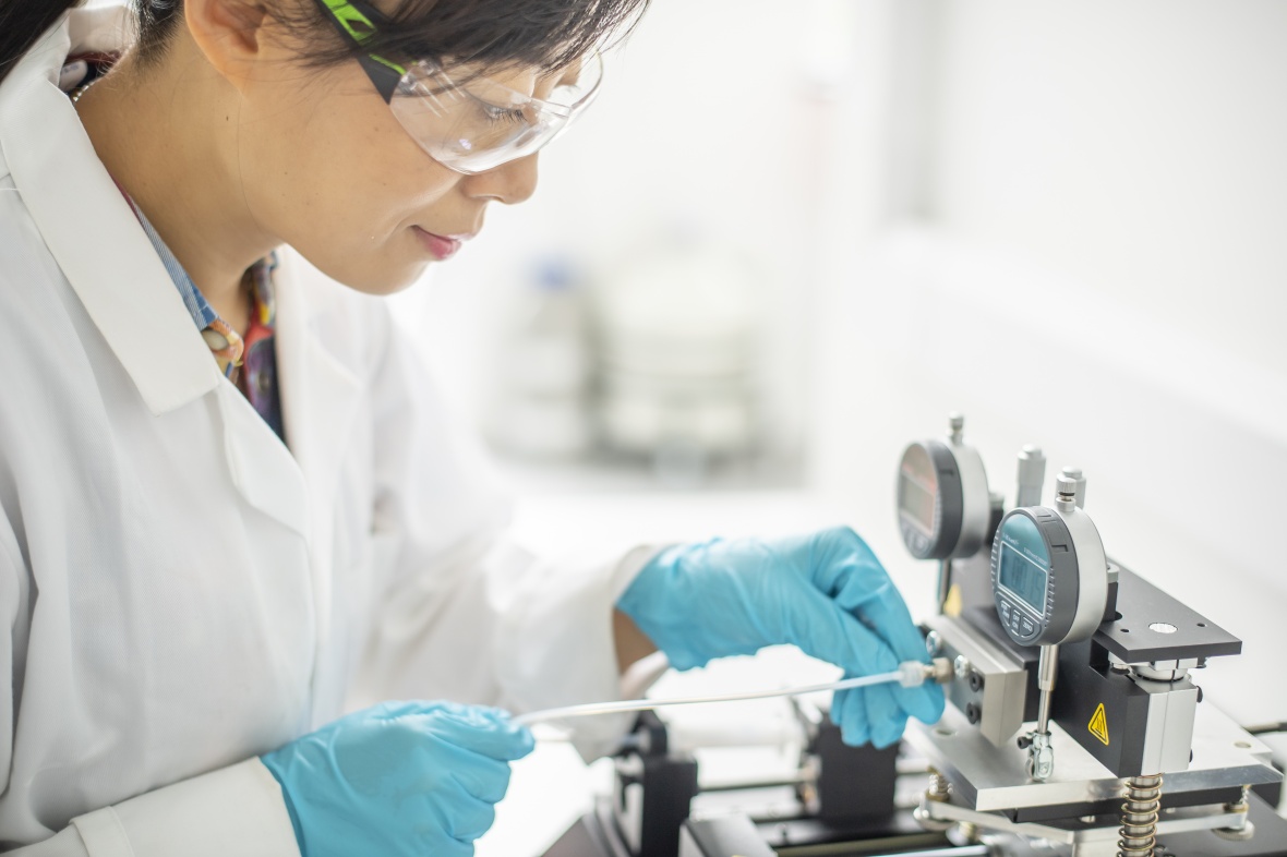 Female scientist researcher working in a lab environment