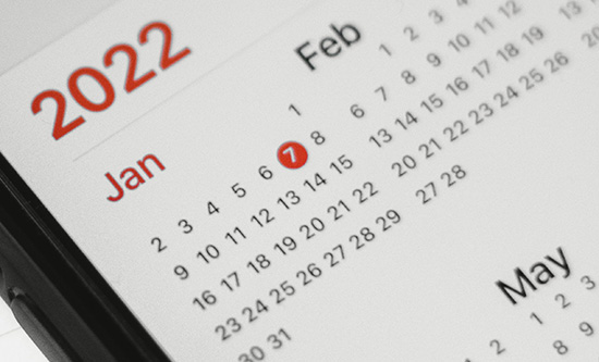Calendar on mobile phone showing January and February 2022