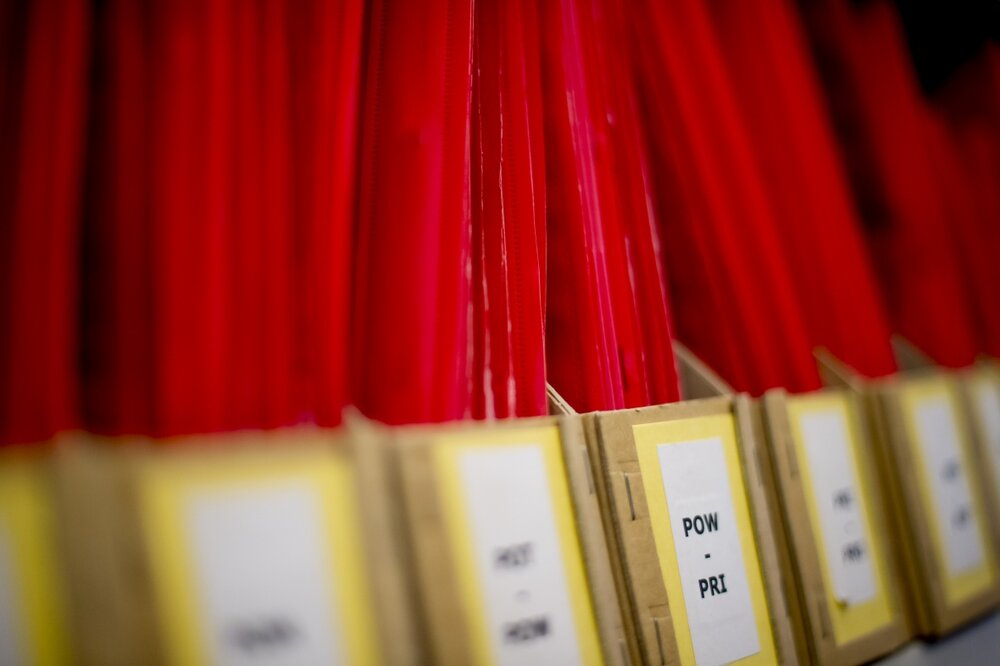 Image of red files in manila folder