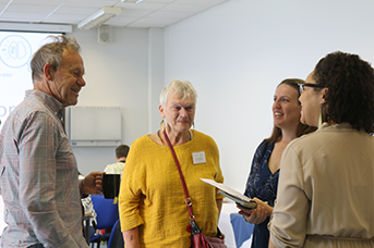 Researchers talking to members of public about rehabilitation