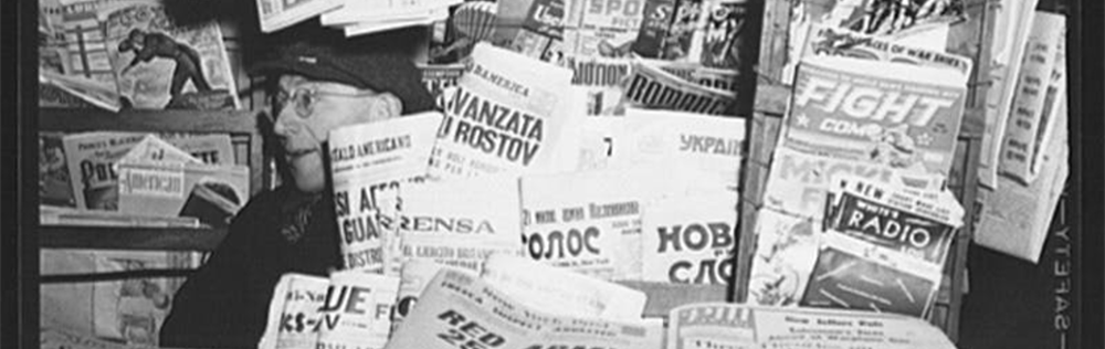 Blacks and white image of male newsvendor in hut
