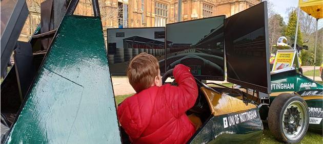 Student driving a virtual racing car