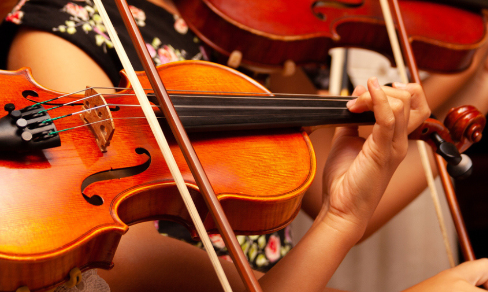 Close up of two violins being played