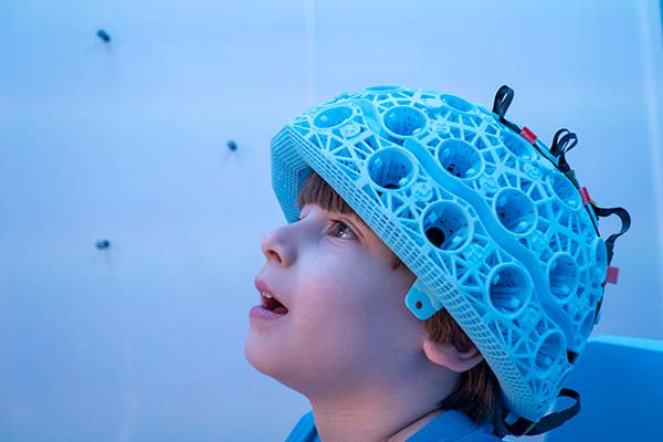Child in awe with a special helmet on