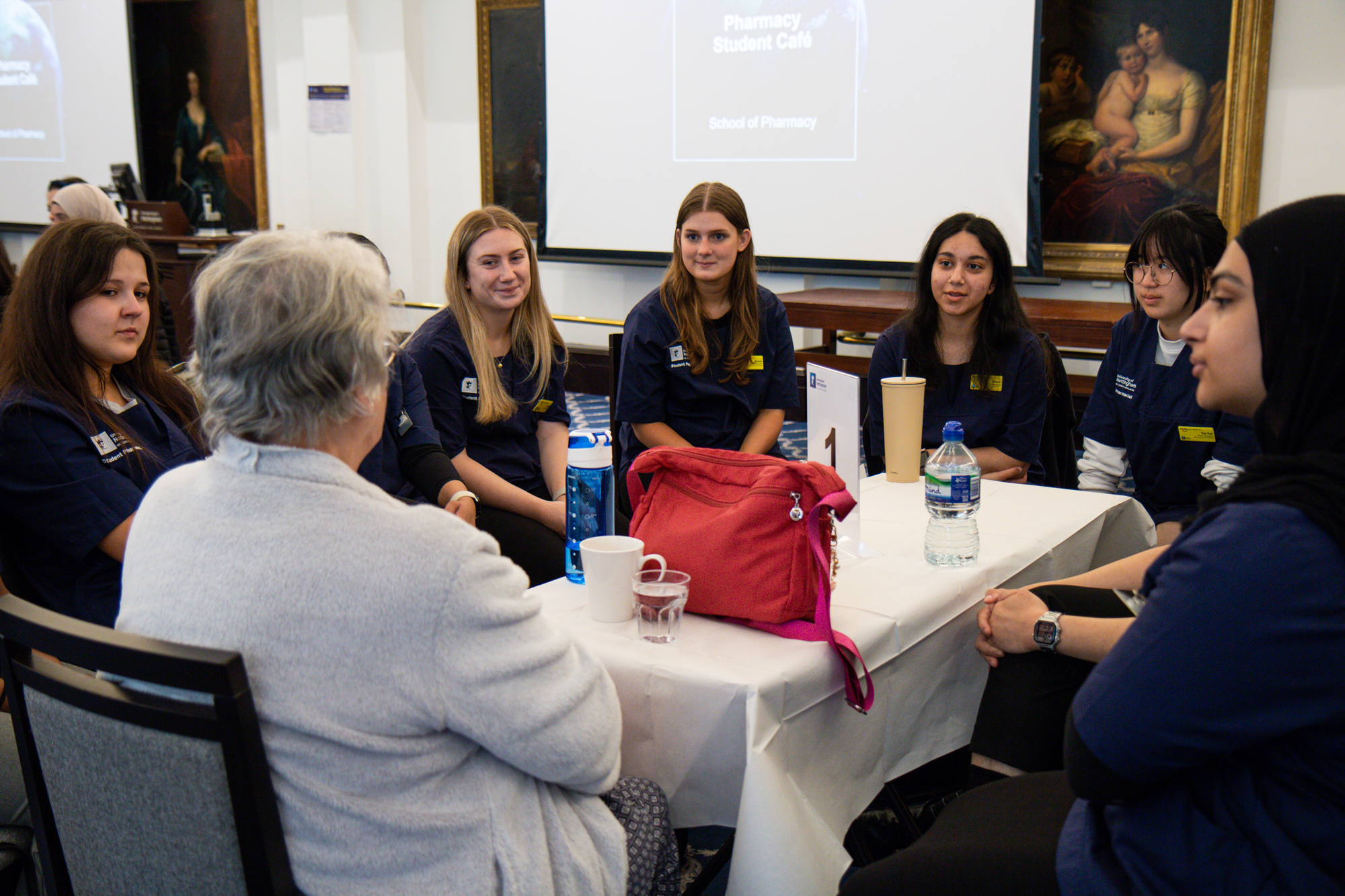 Students speaking to a volunteer.