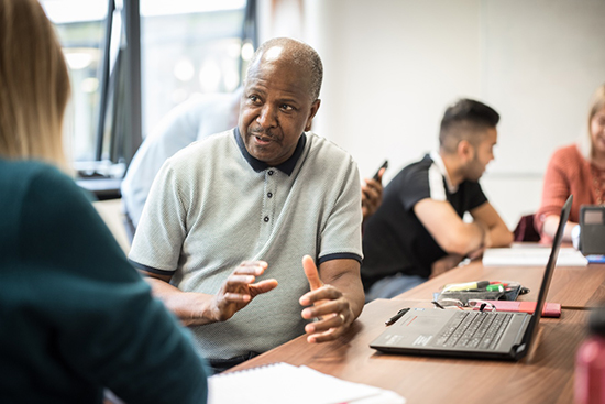 Mentor speaking to a student.