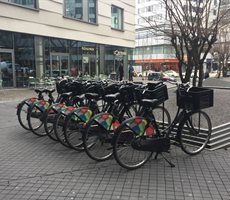 A row of bicycles with baskets on the front in Berlin.