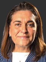 Head and shoulders photo of Professor Marina Novelli. Marina has shoulder length brunette hair and is wearing a white top with a blue jacket which has fine white stripes on it.