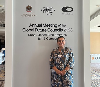 Photo of Professor Marina Novelli at the World Economic Forum's Global Future Council on the future of sustainable tourism. Marina is stood in front of a wall that says: Annual Meeting of the Global Future Councils 2023, Dubai, United Arab Emirates, 16-18