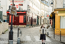 Elysia walks down a cobbled street in Montmartre