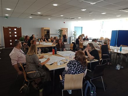 First shot of small-group discussion in progress amongst the Libraries Staff Team