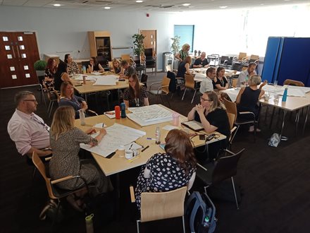 Second shot of small-group discussion in progress amongst the Libraries Staff Team