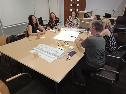 First shot of small-group discussion in progress amongst the Cultural Participation Staff Team