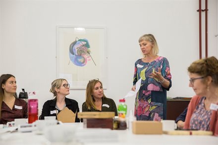 Cat Rogers speaking at an event for creatives