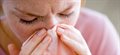 How is influenza transmitted between people?