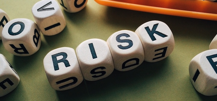 Dice with letters spelling the word risk