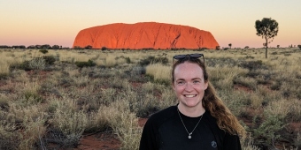 Helen Cridland with Uluru in the background