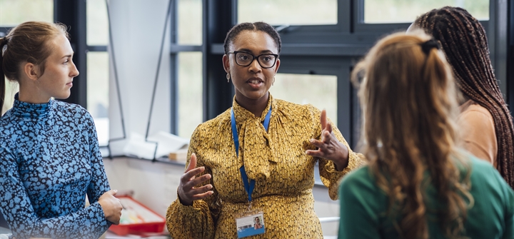 Group of women talking in a professional setting