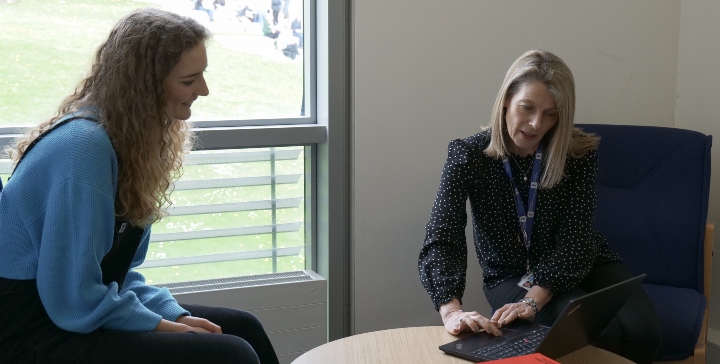 Careers adviser talking to a researcher