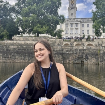 Claudia Medina Munoz in a rowing boat with the Trent Building in the background