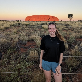 Helen-Cridland standing in front of Uluru/Ayers Rock