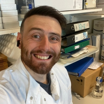 Matthew Padgett smiling in an office