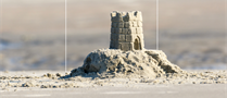 A sand castle on a beach.