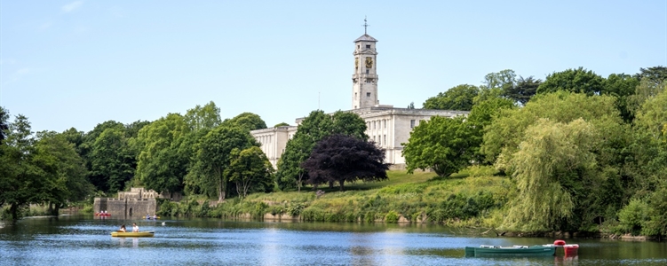 Trent Building as seen over the University Park Campus lake.