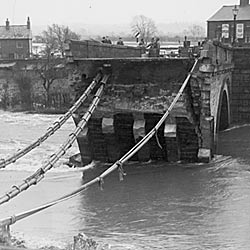 Photograph showing Cavendish Bridge destroyed after flooding in 1947 in Shardlow, Derbyshire